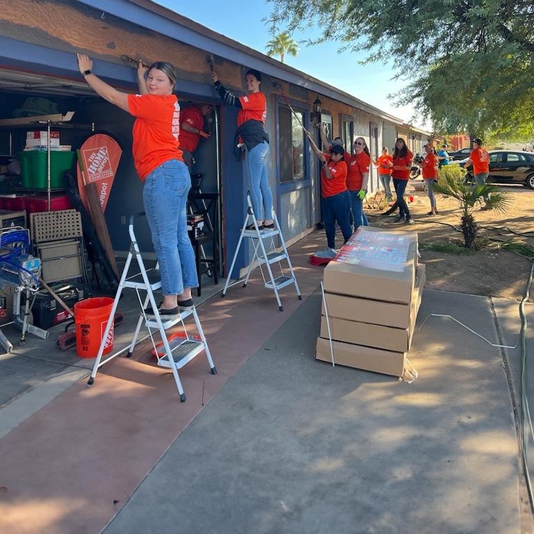 The Home Depot Foundation and HandsOn Greater Phoenix volunteers work on a veterans home.
