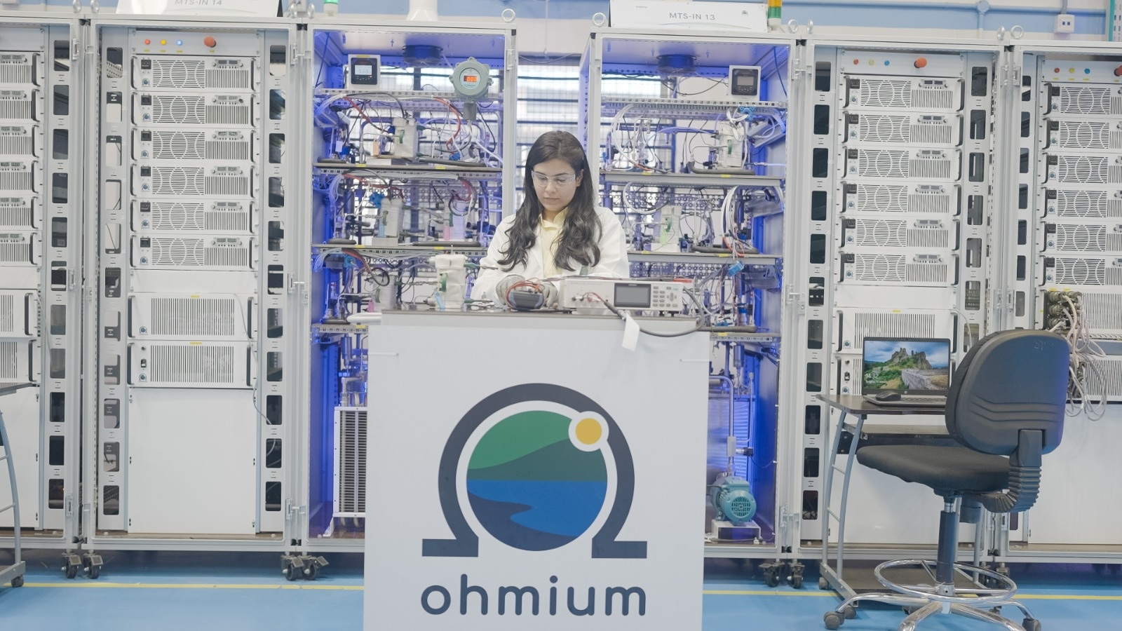 Ohmium employee working with electrolyzers for green hydrogen - making green hydrogen from seawater