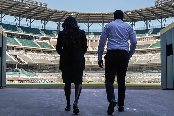 two people walking into a stadium