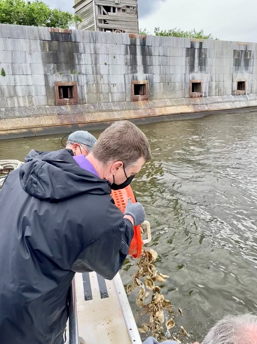 students planting oyster spat