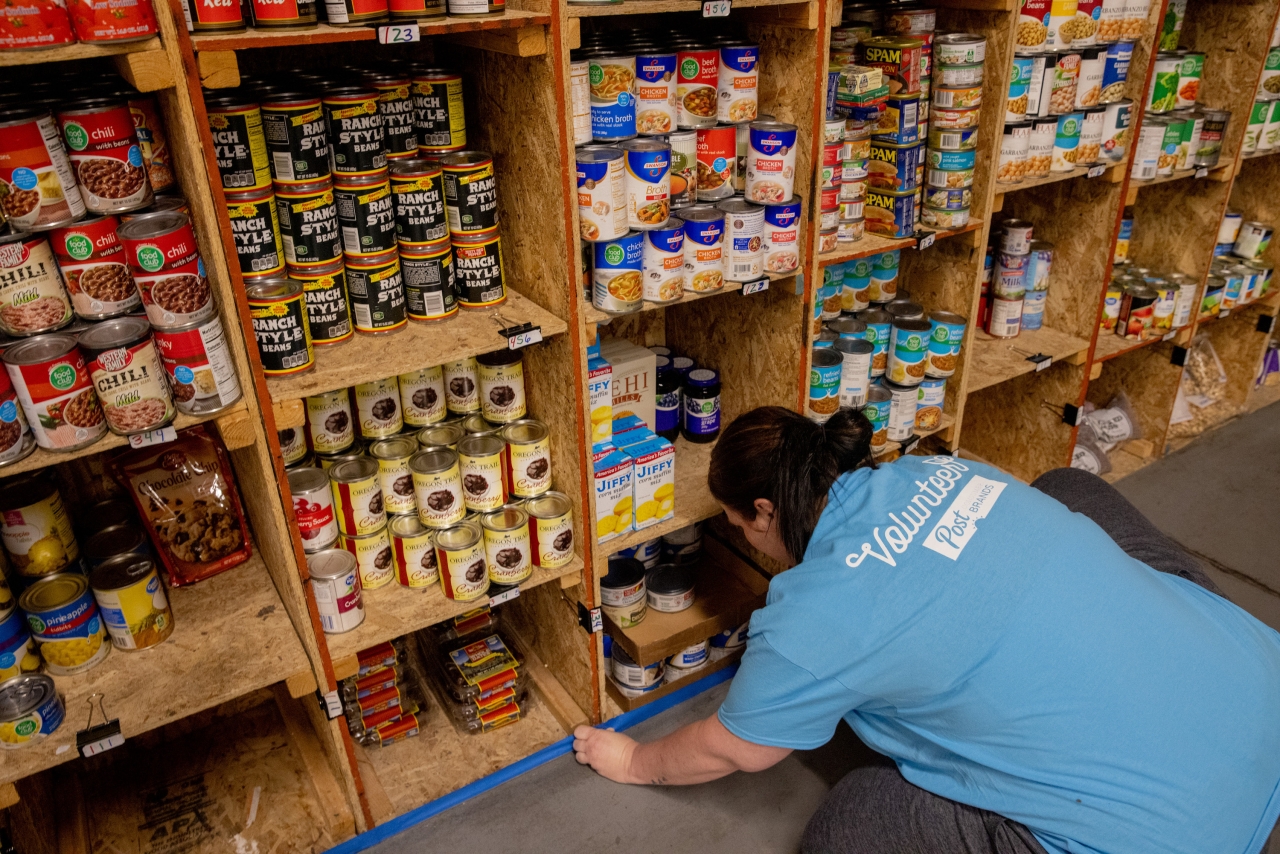 Post Consumer Brands employee, Melissa Hansen, preps a space for painting while volunteering on a service project at the Tremonton Food Pantry on Wednesday, Apr. 13, 2022 in Tremonton, Utah (Kim Raff/Post Consumer Brands)