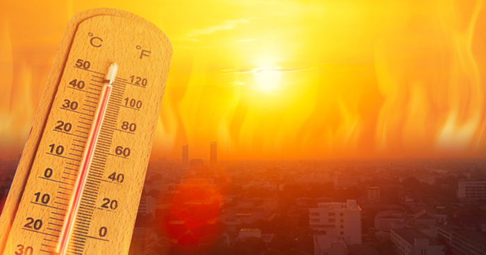 Thermometer shown against a blazing red sun.