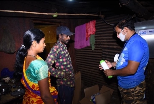 group of three people talking inside home