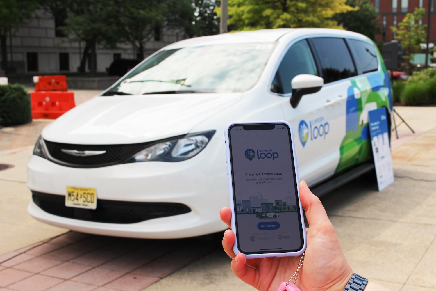 Person using the Camden Loop App to hail a ride on microtransit in Camden New Jersey