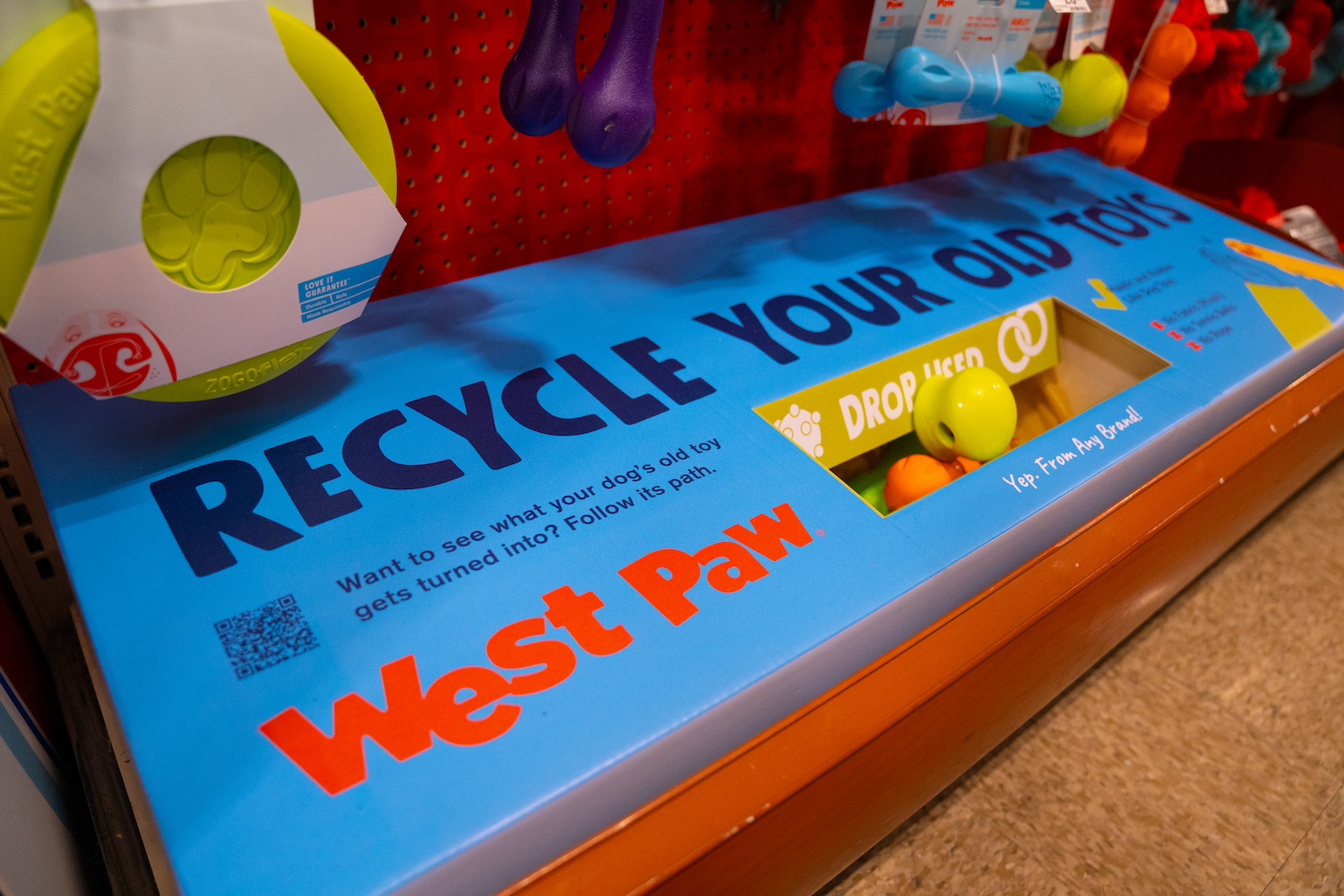 The box that people can put toys in to be recycled. 