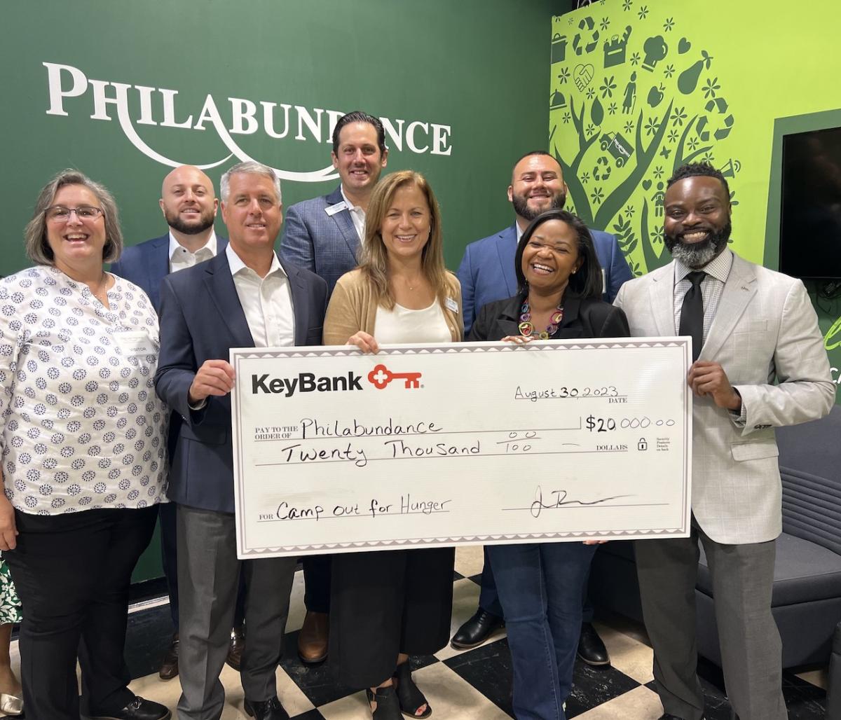KeyBank presents a check in the amount of $20,000 to Philabundance Inc. From left to right: From left to right: Julie Vetack, Key@Work Relationship Manager, KeyBank; Robert Lombardo, Area Retail Leader, KeyBank; Jamie Tranfalia, Market President, KeyBank; Scott Fremont, Director of Individual Giving, Philabundance; Kristine DelMonte, Chief Development Officer, Philabundance; Juan Hurtado, Branch Manager, KeyBank; Loree D. Jones Brown, CEO Philabundance and Chiwuike Owunwanne, Corporate Responsibility Office