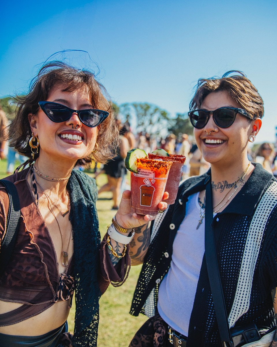 people using reusable cups at a music festival — sustainability at music festivals