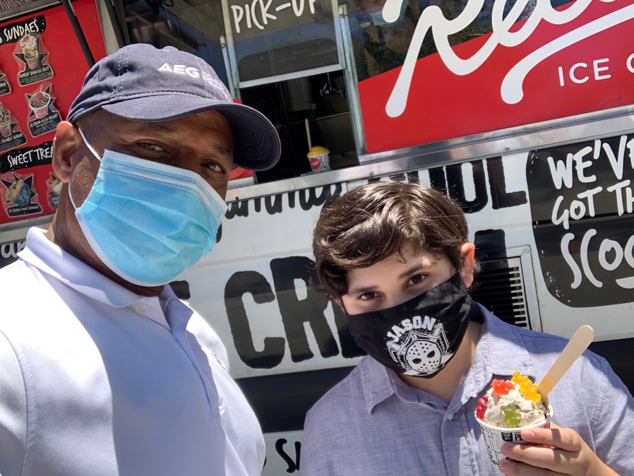 A student receiving a backpack and ice cream