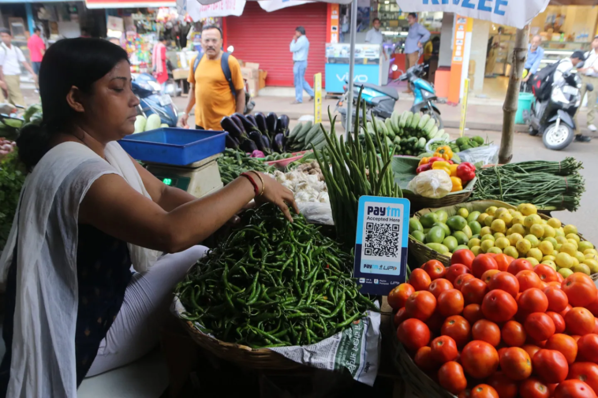 Woman working at a vegetable stand
