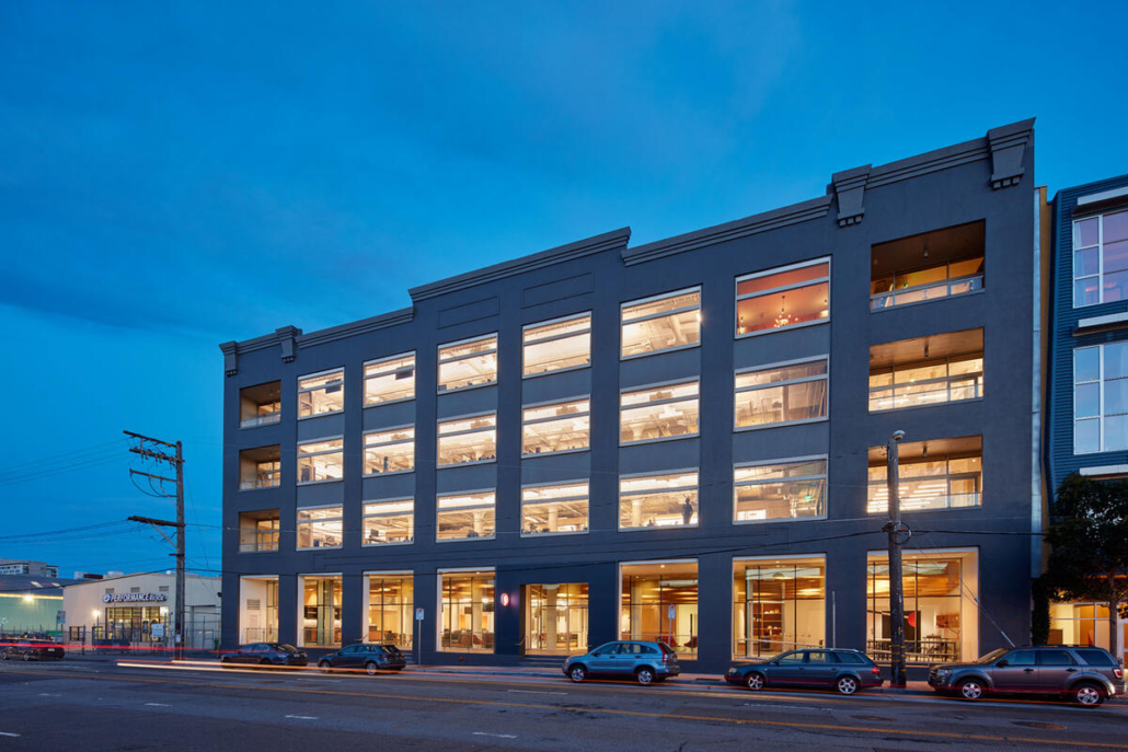 A Pinterest office building seen from outside at night — RECs