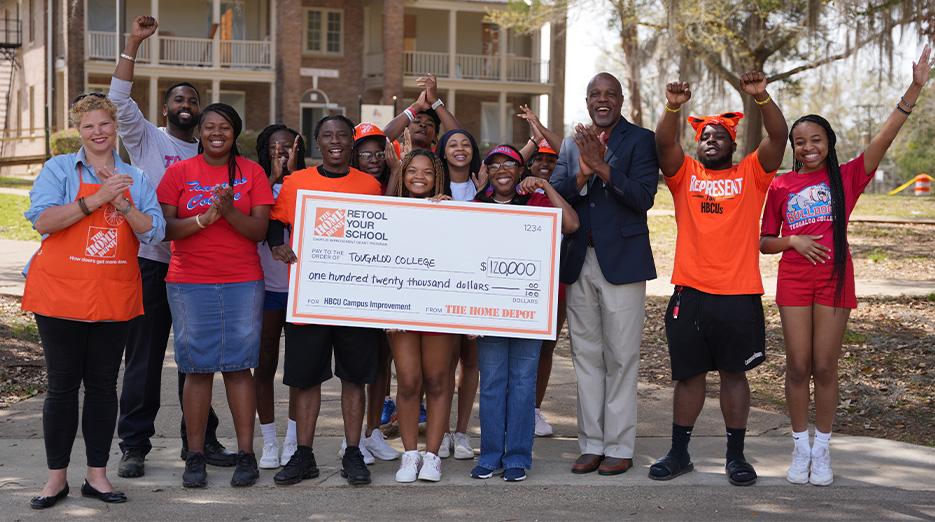 Representatives from Tougaloo College shown with a $120,000 check.
