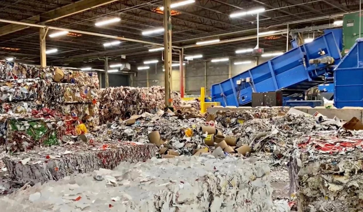 Truck dropping off a load at recycling facility