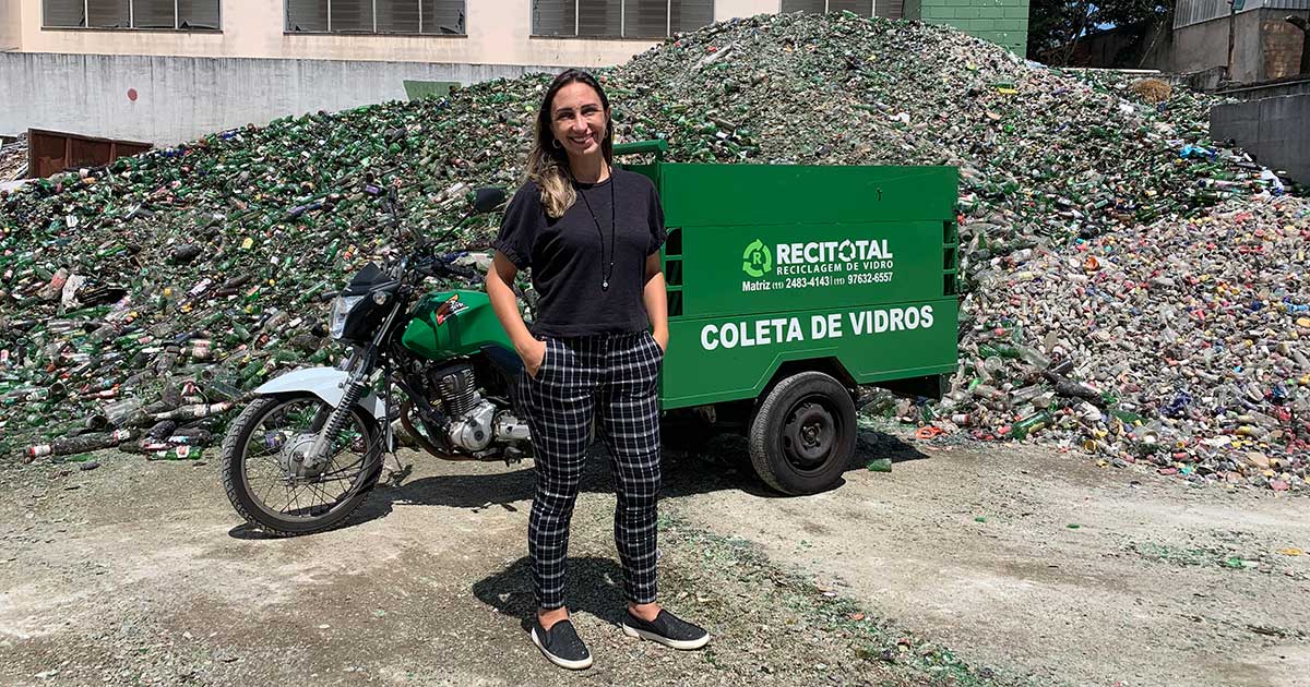 Renata Tambasco standing in front of recycled glass