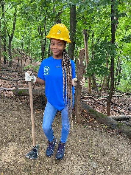 SCA Team member preparing the ground for planting. 