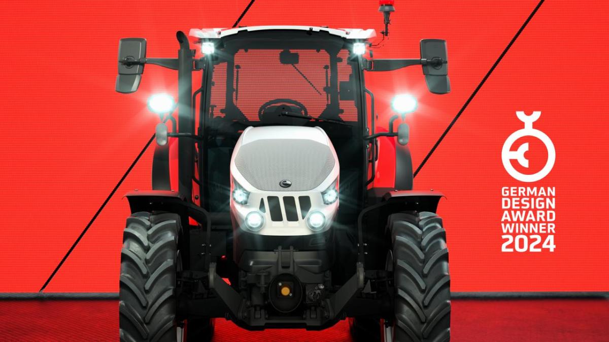 a tractor infront of a red backdrop at the 2024 German Design Awards