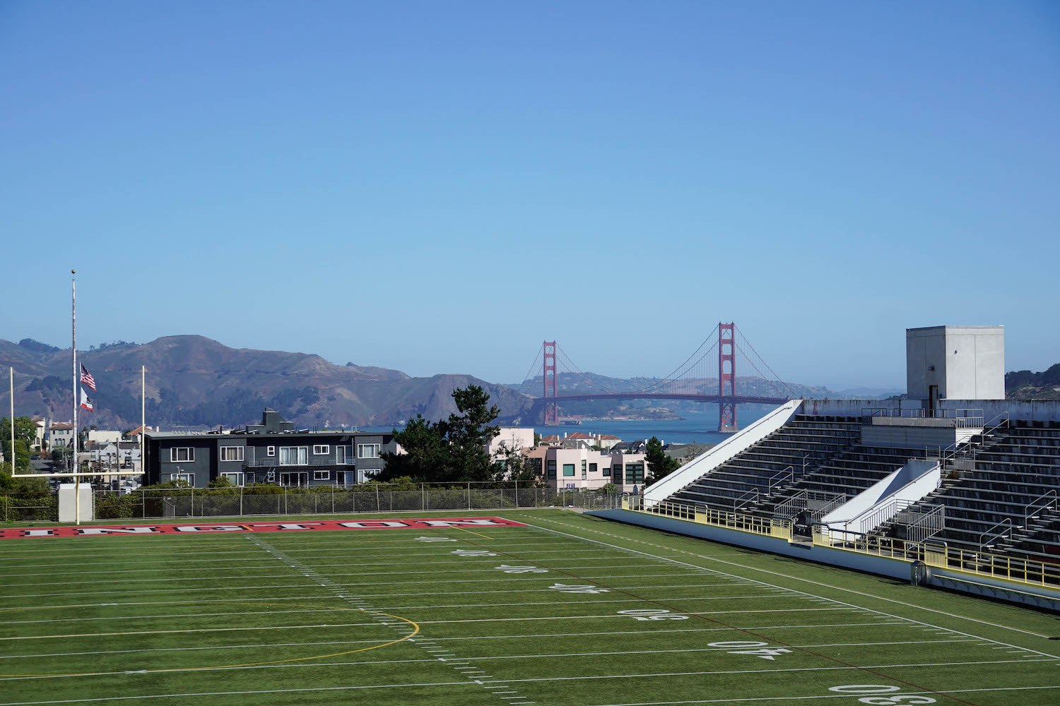 The football field at George Washington High School in San Francisco overlooks the Golden Gate Bridge.