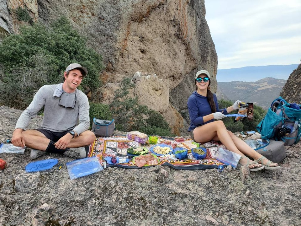 REI guides prepare a lunch spread in the middle of Pinnacles National Park