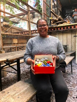 Person sitting with box of crafts