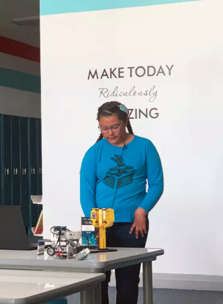 Abigail Cota, a member of the Shoshone, Paiute, and Tlingit tribes and student at the Duck Valley Indian Reservation's Owyhee Combined School, demonstrates Lego robots for the Native Voices in Idaho project.