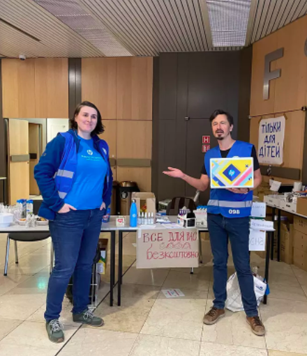 Zuzana Kočanová and Vincent Jamin organize supplies at a refugee center in Prague.