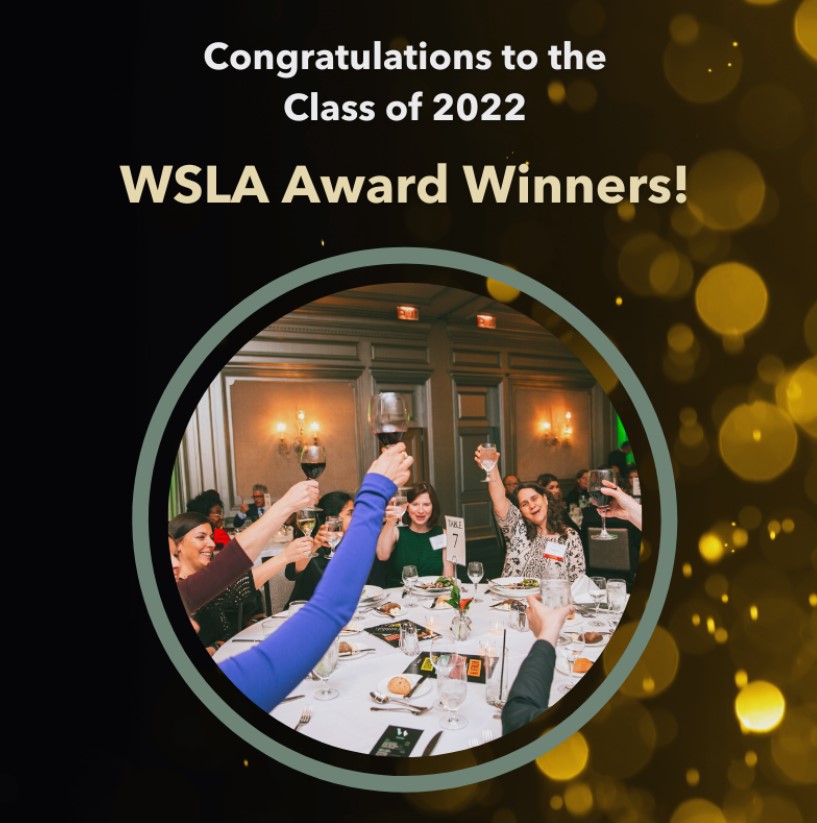 Group of people toasting at a table. Above are the words, "congratulations to the Class of 2022 WSLA Award Winners!"