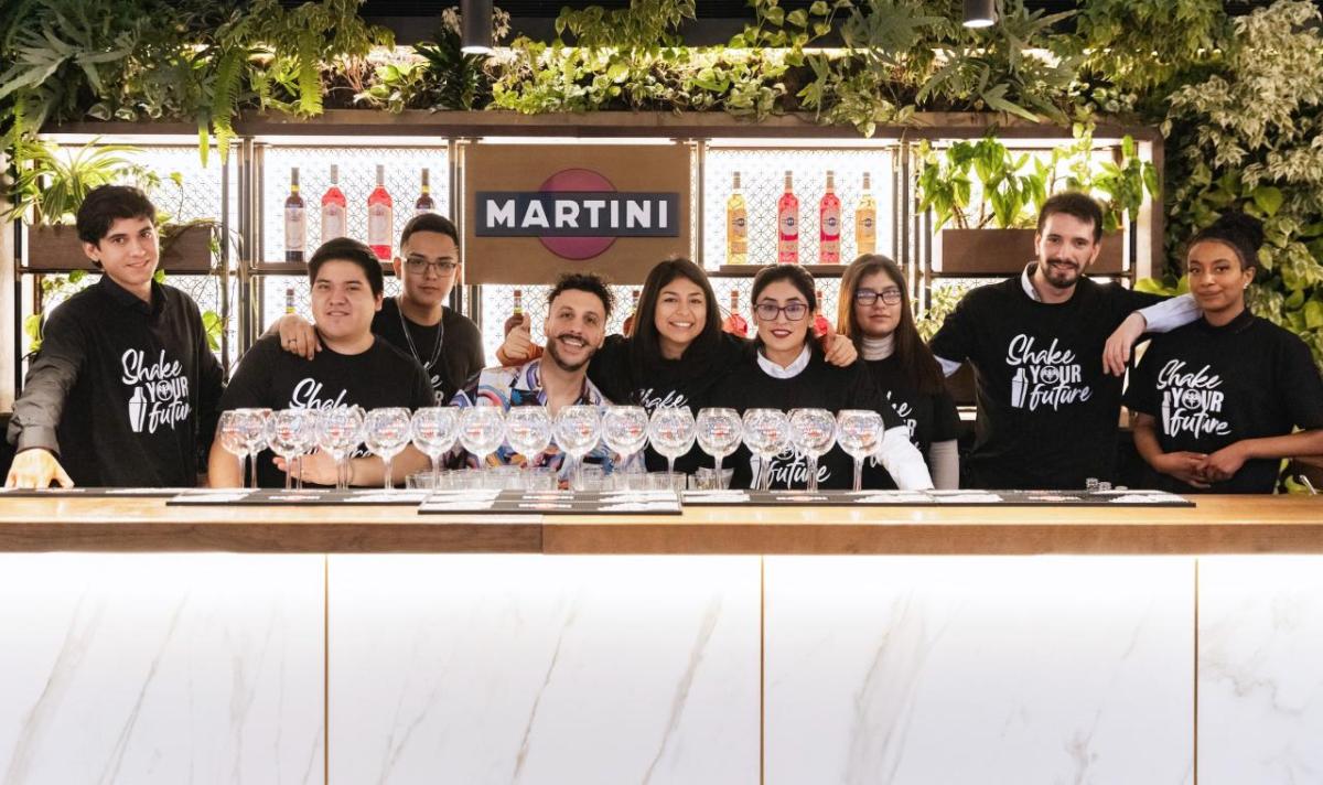 A group of 'Shake Your Future' students stood behind a bar