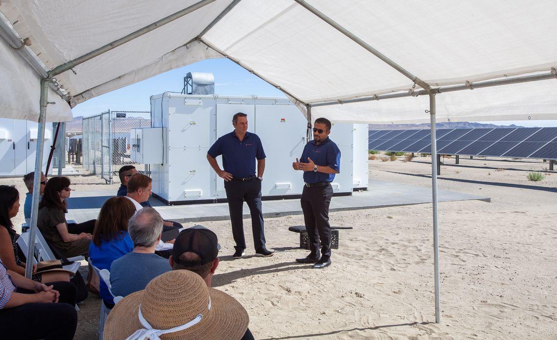 Jared Haines, CEO of Catalyze (left) and Josué Quintanilla, Catlyze's director of project management, discuss the Sheep Creek Community Solar Farm project at a ribbon-cutting ceremony earlier this month. 