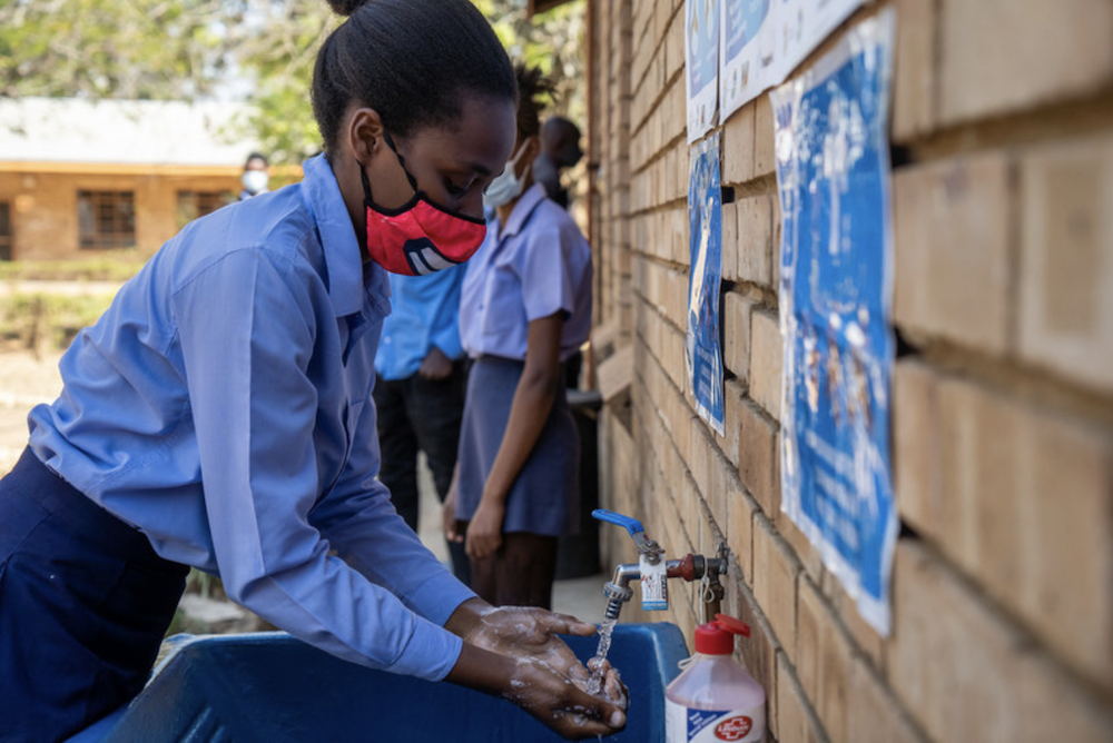 South African school children use outdoor hand washing station
