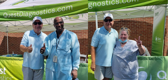 Steve Rusckowski with Simon Rock and Gretchen Brown of the Quest North Region Patient Services team.