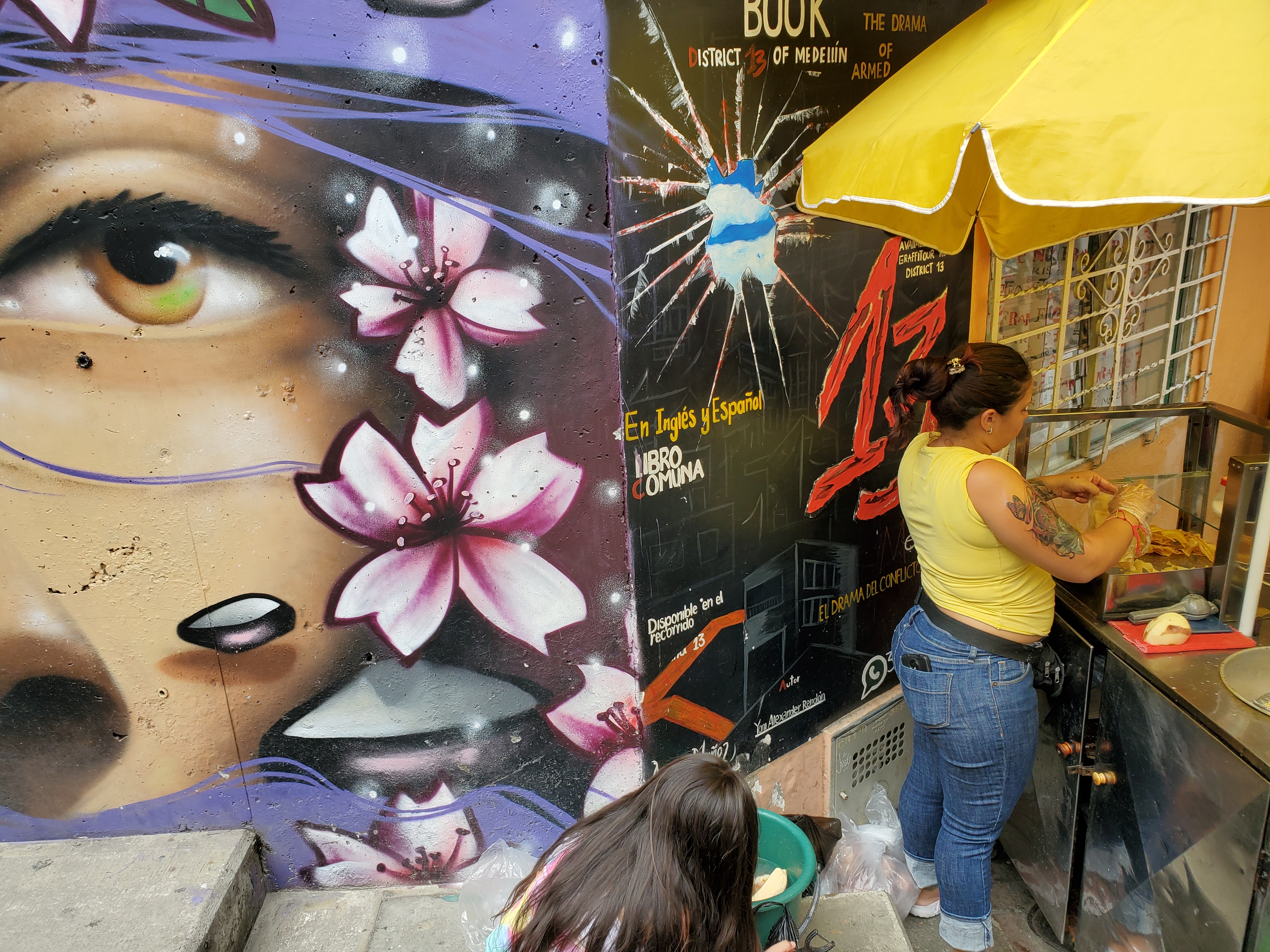 Street vendors minding their business along a Comuna 13 walkway