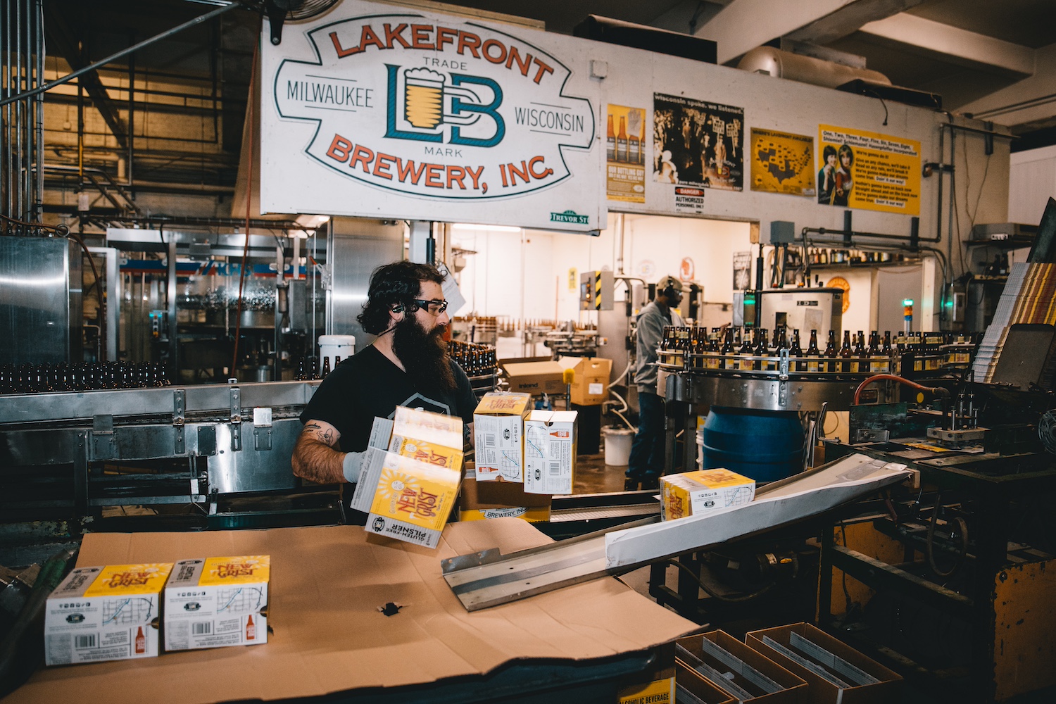 An employee packages bottles of beer inside of Lakefront Brewery. 