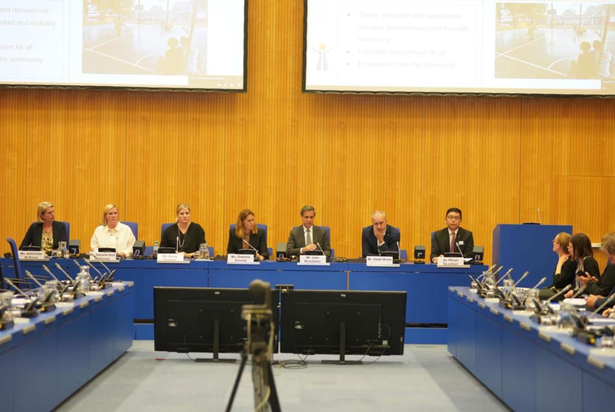 Panel of delegates in rows at an official conference