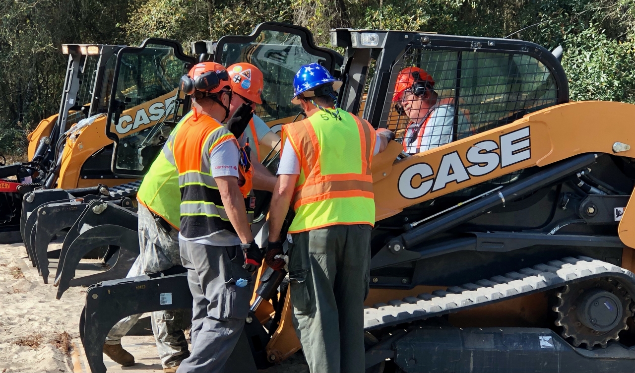 CNH employees with equipment