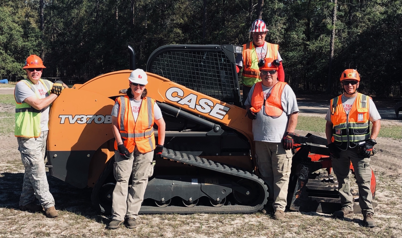 CNH employees with equipment