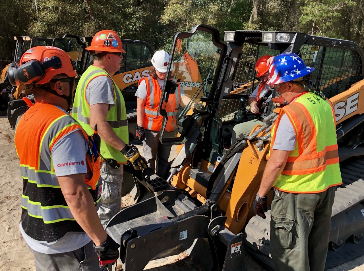 CNH employees with equipment