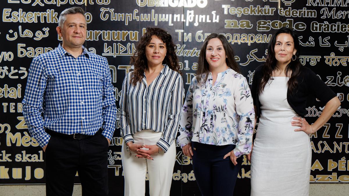 The U.S. Bank translation team members are, from left, Javier Lesich, Zarya Rosette, Alicia Lopez and Rosaura Figueroa. This photo was taken inside the U.S. Bank Tower in Los Angeles and the wall behind them says “thank you very much” in different languages.