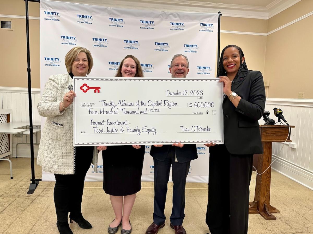 Trinity Alliance representatives receive a $200,000 grant from KeyBank.