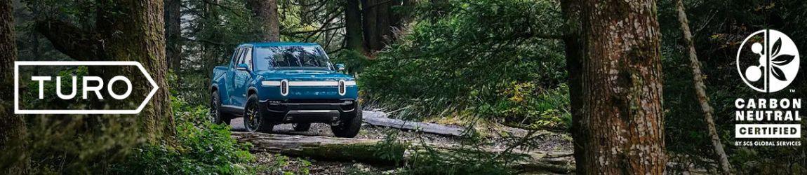 Truck in the woods, with Carbon Neutral Certified logo