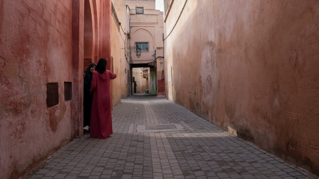 Two Moroccan women sharing a quiet moment in Meknes, Morocco