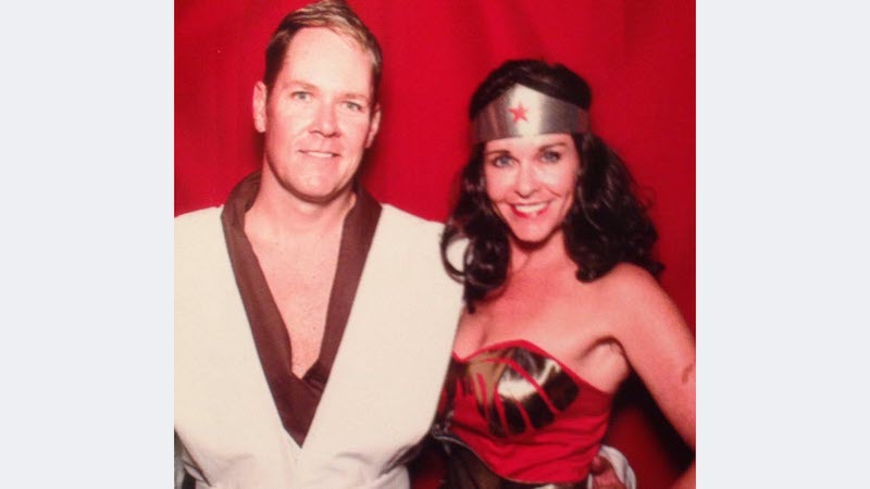 Erica Opstad dressed as Wonder Woman for a Halloween party and her husband Keith.