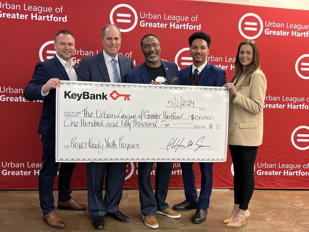 Leadership from the Urban League of Greater Hartford shown with a $150,000 check from KeyBank.