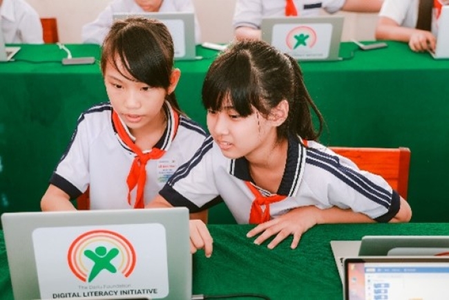 two students on laptops