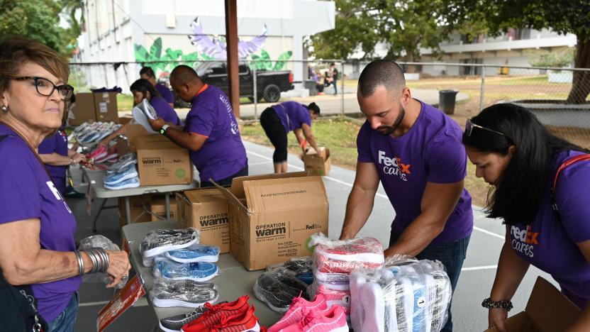 FedEx team members packing shoes to be delivered to local schools.