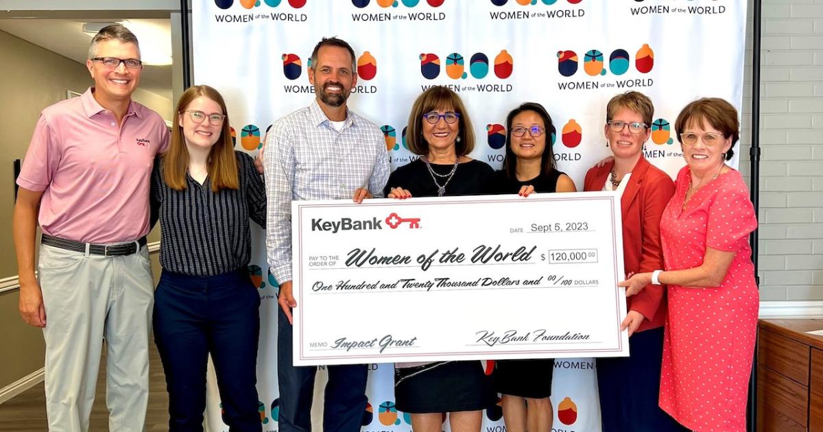 Women of the World check presentation by the KeyBank team.