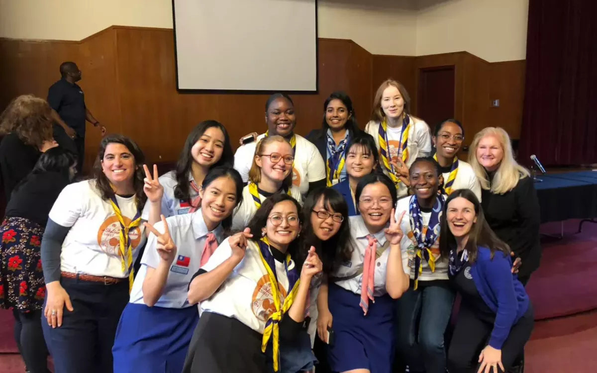Kim Allman, h=Head of Corporate Responsibility at Gen, with a group of scout leaders from the World Association of Girl Guides and Girl Scouts