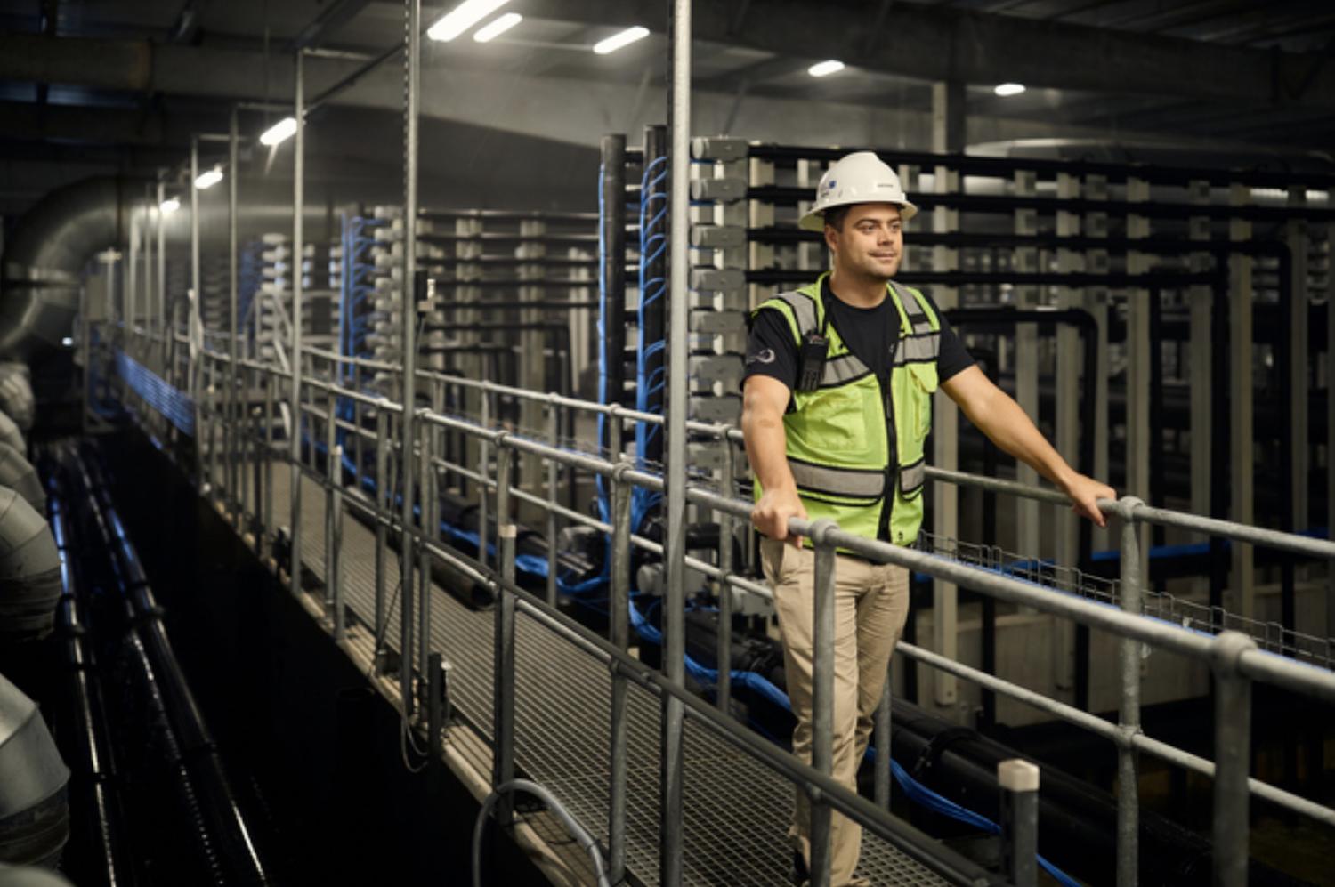 Worker at a sustainable indoor fish farm - sustainable aquaculture