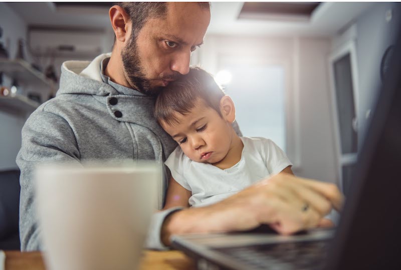 Father holding his son.