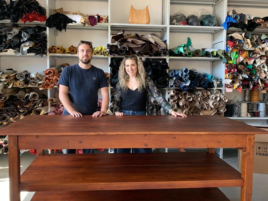 Cassandra Kane and Gabriele Rorandelli, the two cofounders of Zerolab, in front of some of the leather they’ve saved from the landfill for reuse. 