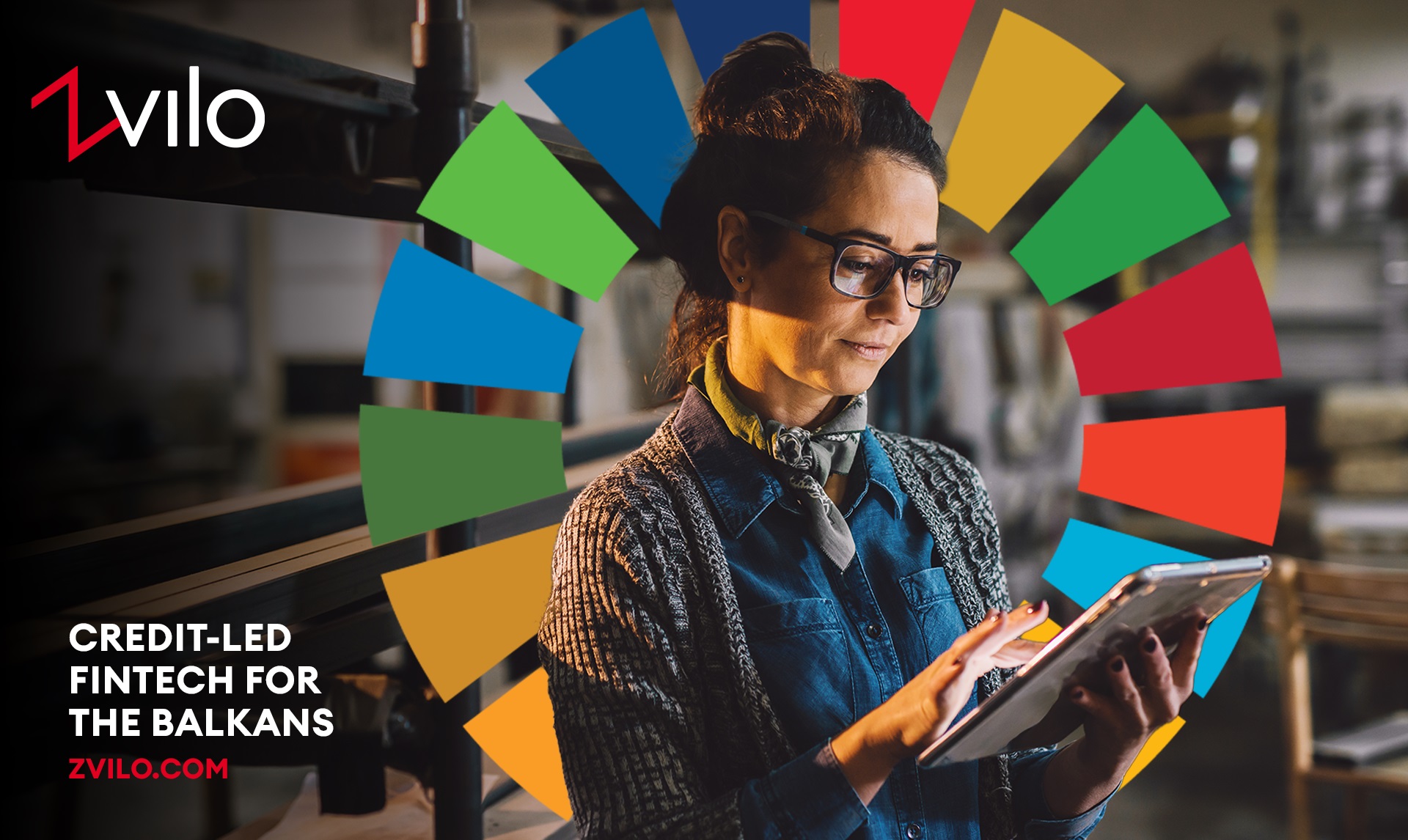 Person using tablet with SDGs logo in background