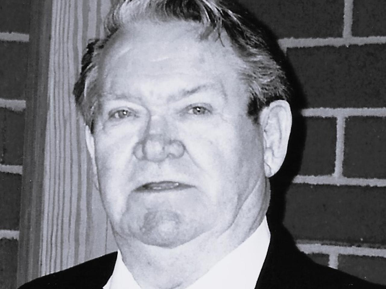 Black and white headshot of a man